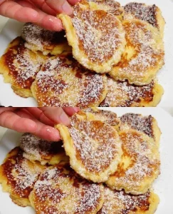 Delicious apple pancakes stacked on a plate with syrup and apples