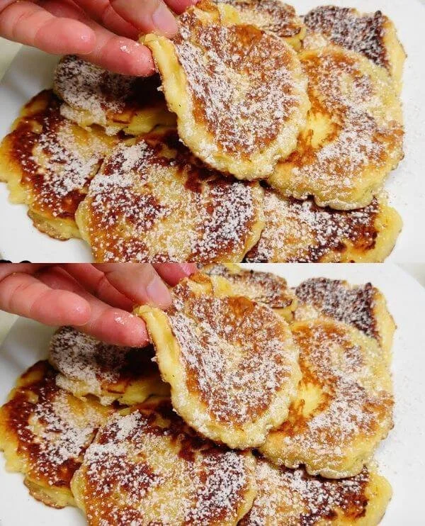 Delicious apple pancakes stacked on a plate with syrup and apples
