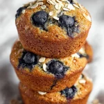 Freshly baked blueberry oatmeal muffins with plump blueberries