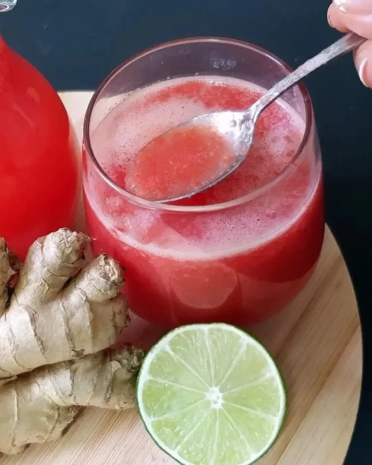 Fresh tomato ginger drink served in a glass with garnishes