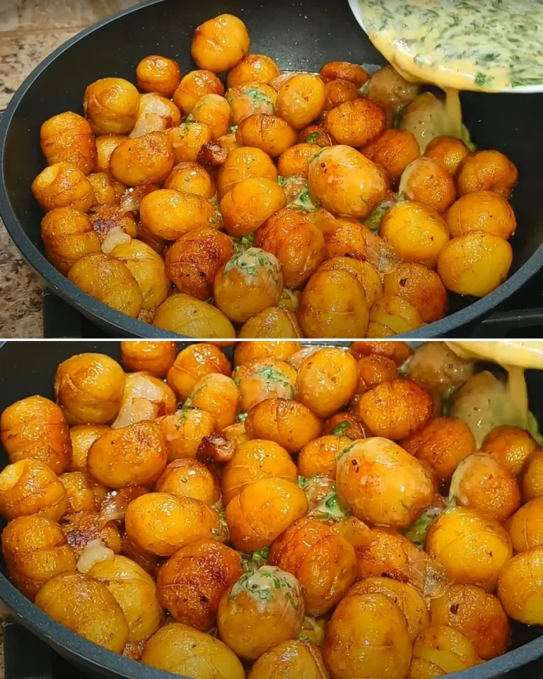 Plate of crispy fried potatoes filled with egg, garnished with herbs.