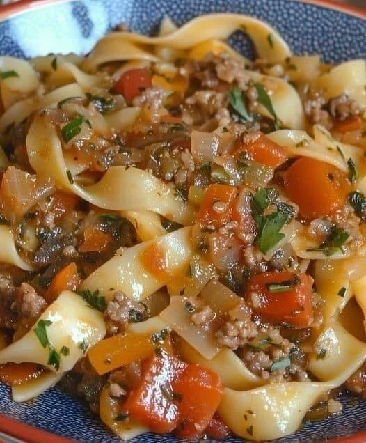 Plate of Italian Drunken Noodles with fresh ingredients and spices