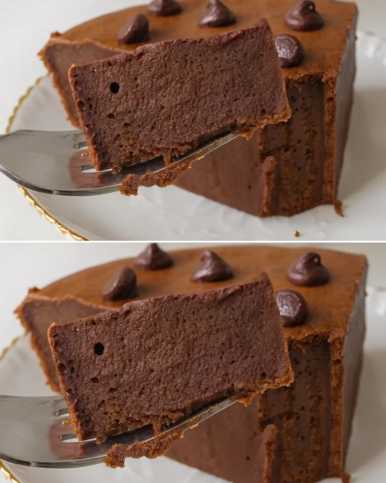 A slice of light chocolate cake topped with chocolate frosting and sprinkles.