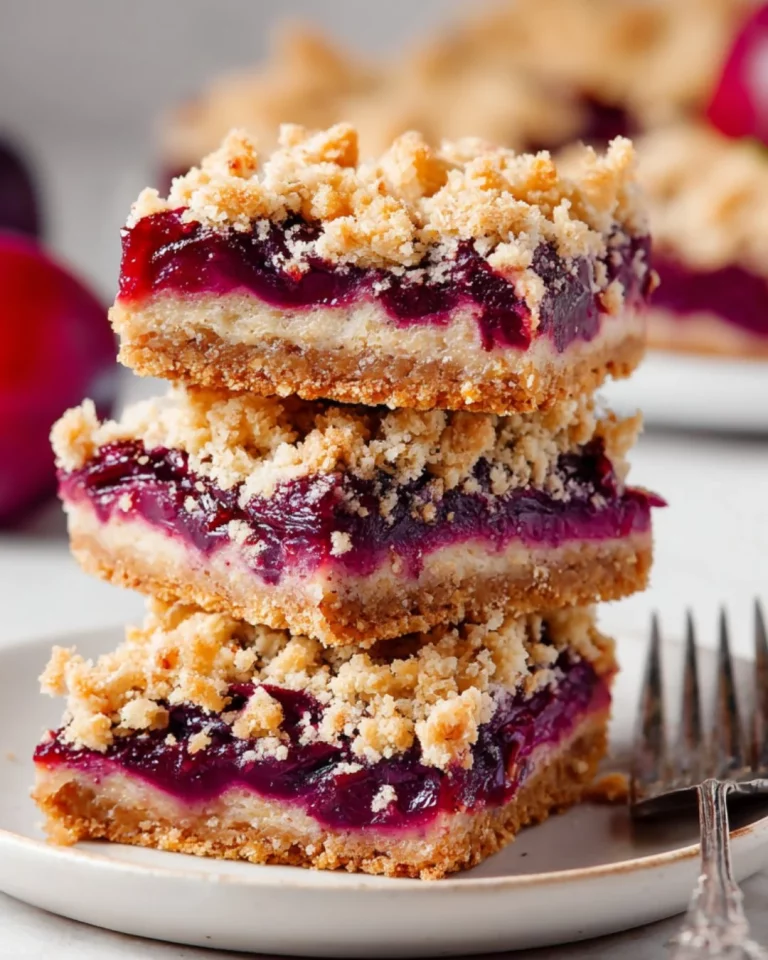 Delicious homemade plum crumble bars with a golden crumb topping