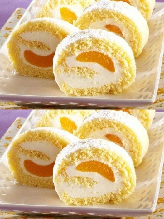Delicious homemade sponge roll dessert garnished with cream and berries