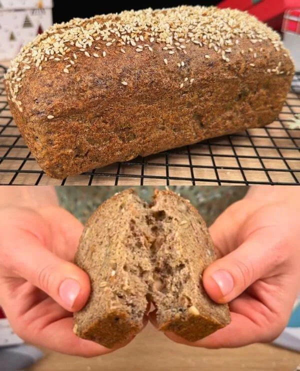 Sliced flourless lentil bread on a wooden board, showcasing its texture and color.