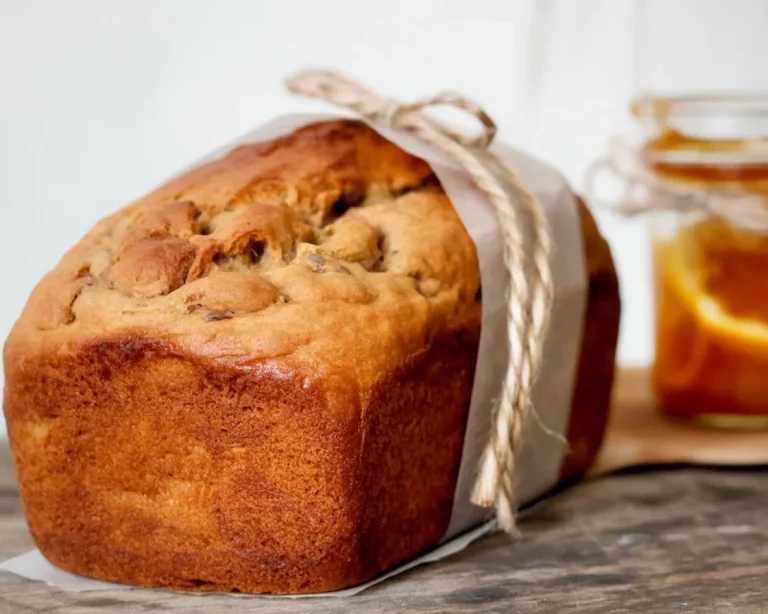 Freshly baked peach chia seed bread with sliced peaches on top.