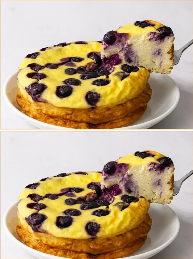 Slice of blueberry yogurt cloud cake topped with fresh blueberries