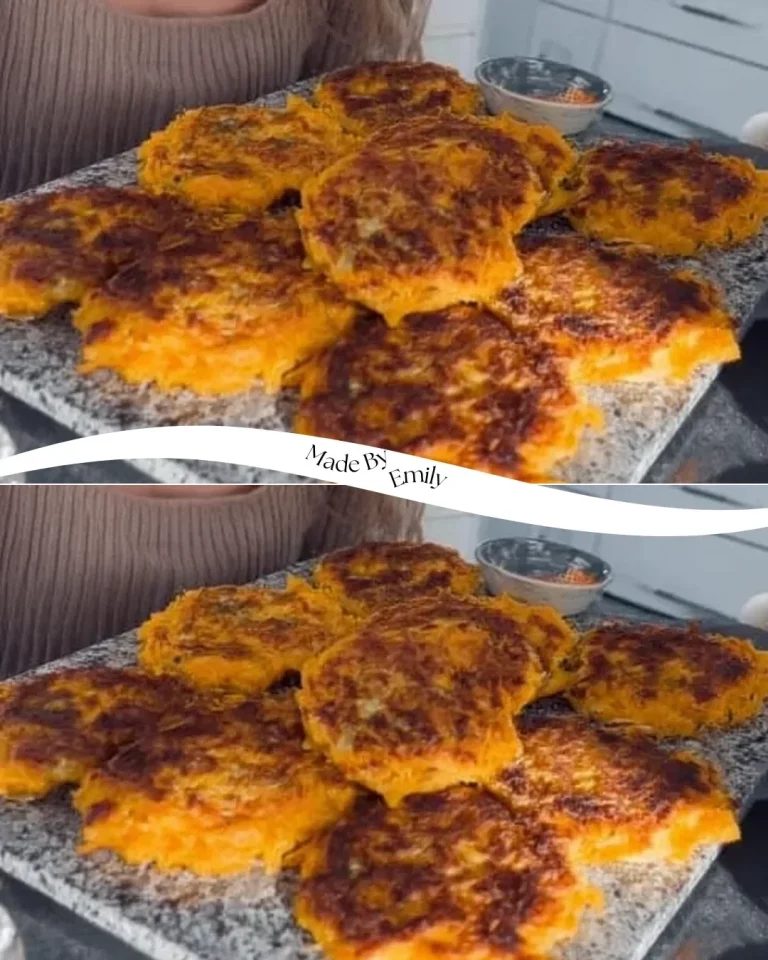 Plate of cheesy butternut squash fritters garnished with herbs