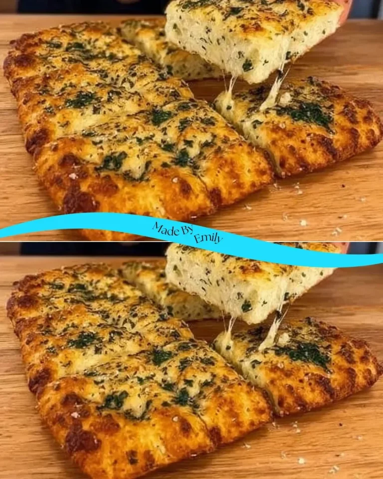 Freshly baked cheesy garlic bread with melted cheese and herbs