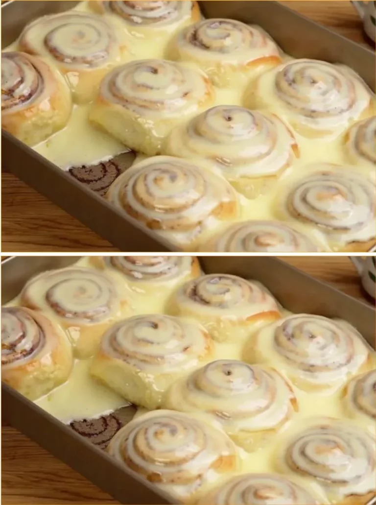 Freshly baked homemade cinnamon rolls with cream cheese frosting.