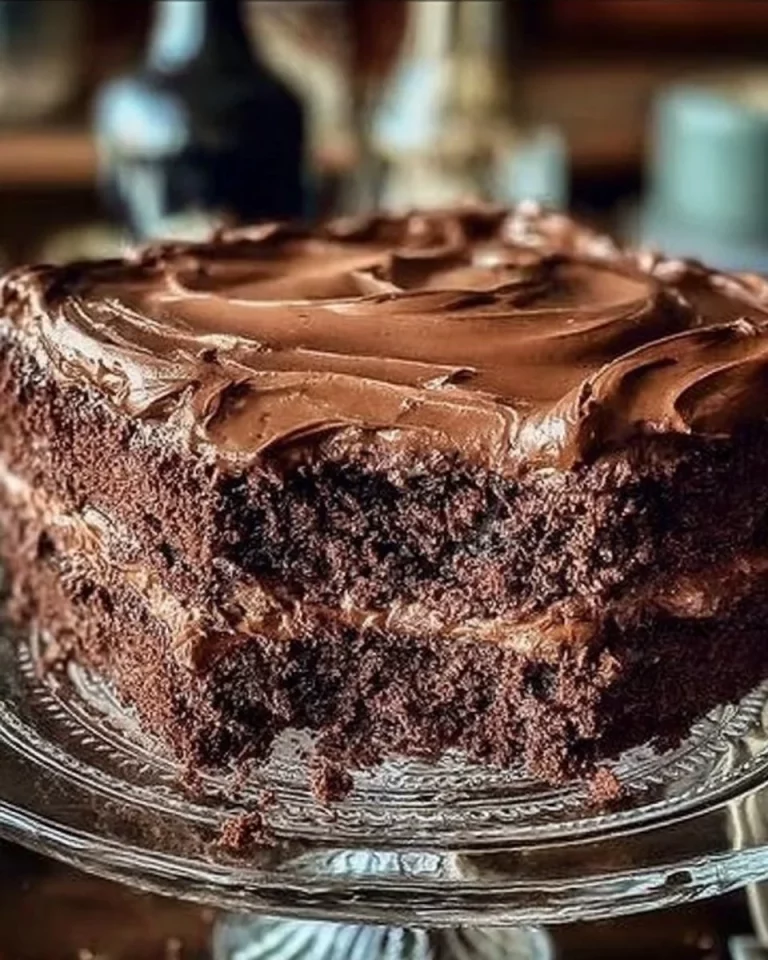 Double Chocolate Coca Cola Cake topped with rich chocolate icing and sprinkles