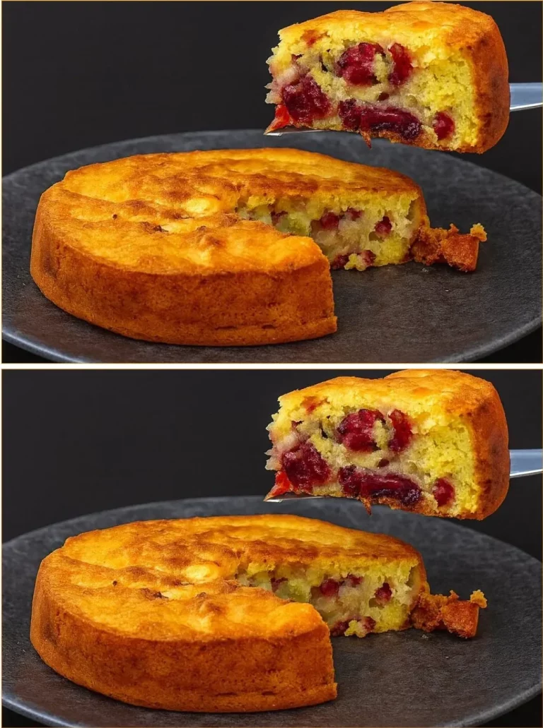 Sliced Golden Plum Crumble Cake topped with crumbly topping and fresh plums