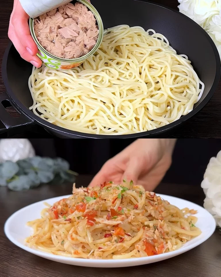 Delicious Tuna Spaghetti dish garnished with herbs and served on a plate.