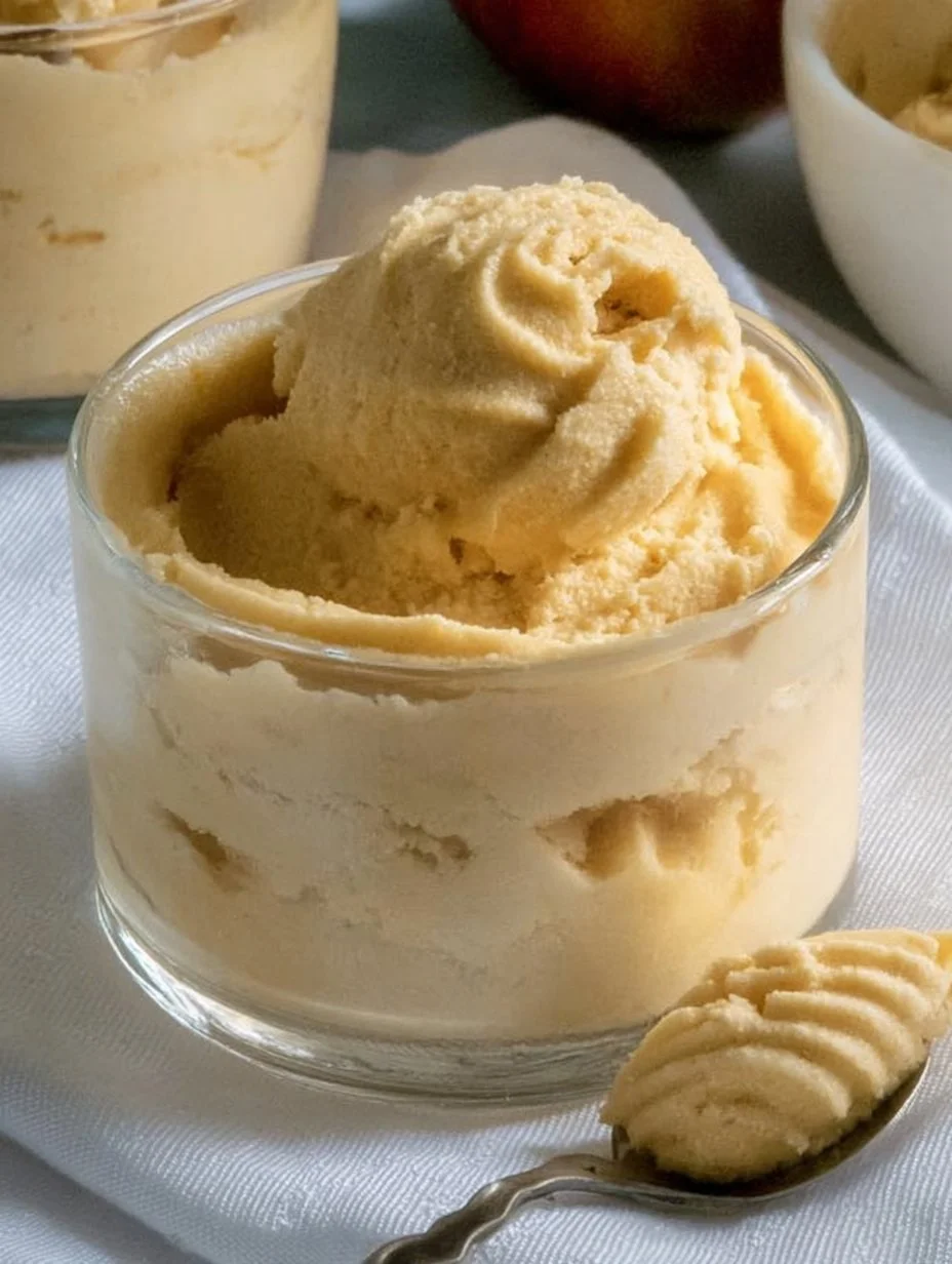 Creamy Keto Pumpkin Cheesecake Mousse topped with whipped cream and spices