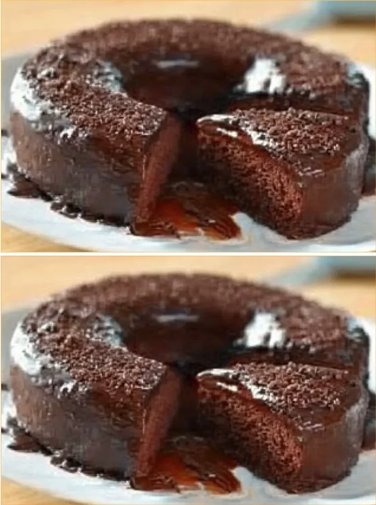 Delicious sugar and flour free chocolate cake topped with cocoa and berries