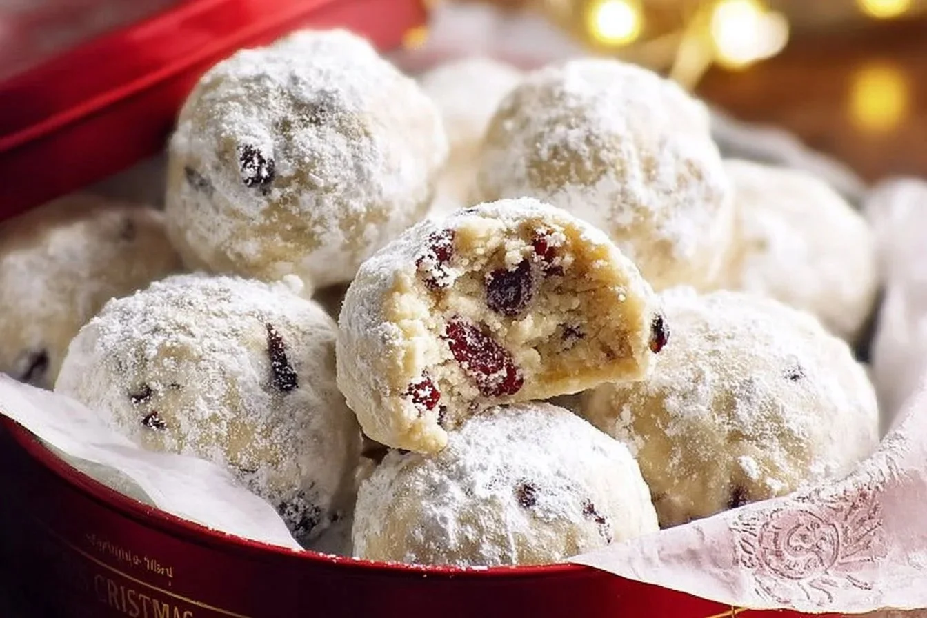 Cranberry Orange Snowball Cookies on a festive plate