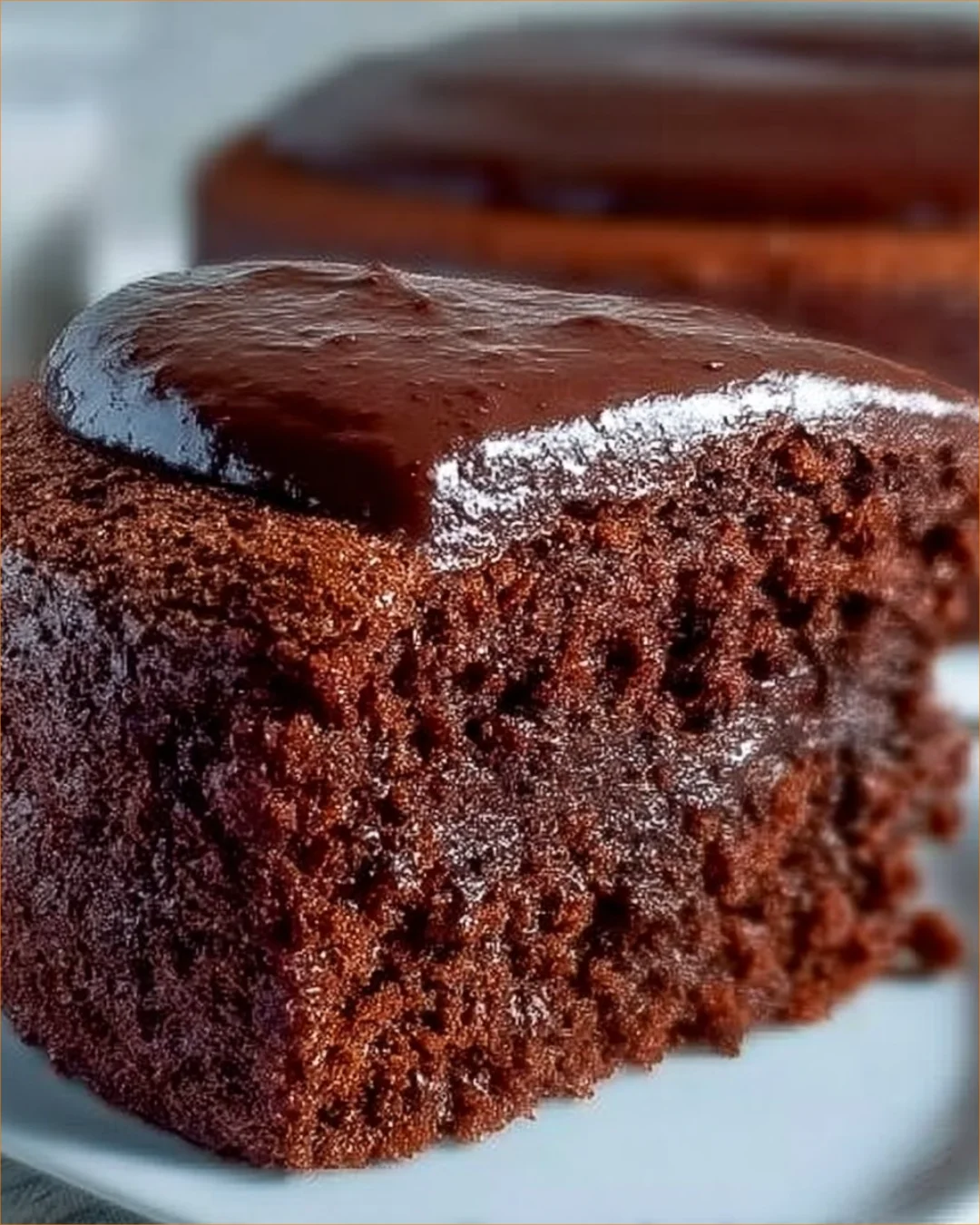 Deliciously moist best chocolate cake topped with rich chocolate frosting.