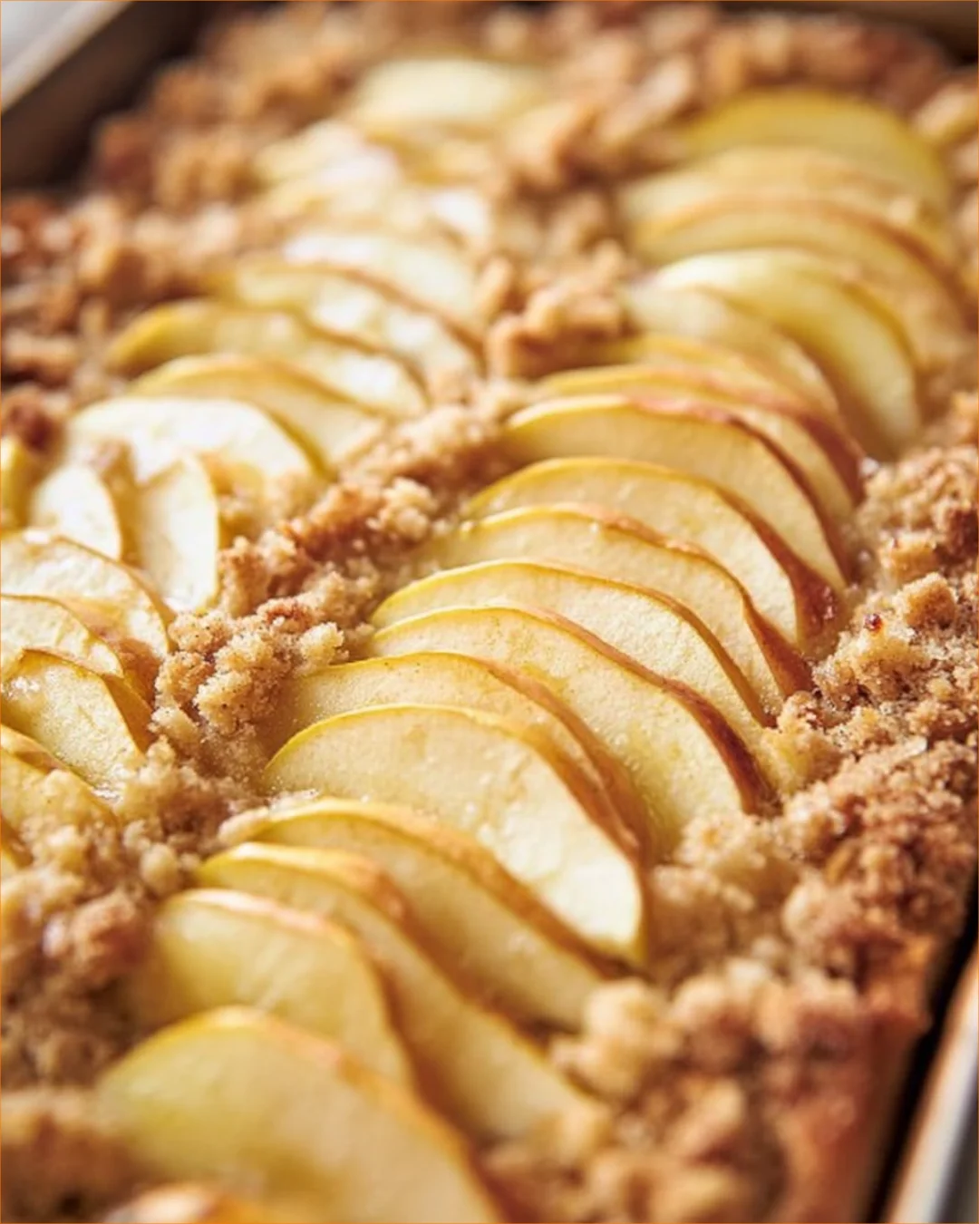Delicious slice of easy German Apple Cake topped with powdered sugar