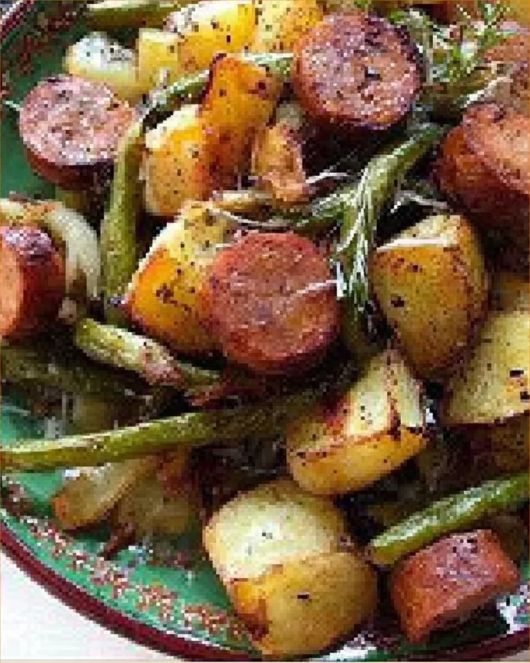 Sheet pan dinner with sausage, green beans, and potatoes ready to serve.