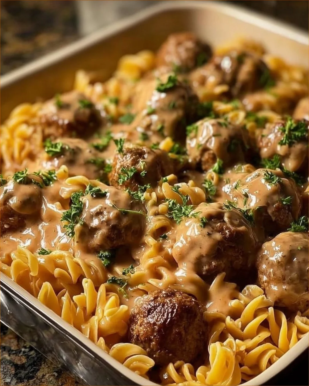 A plate of traditional Swedish Meatballs with creamy sauce and lingonberry sauce