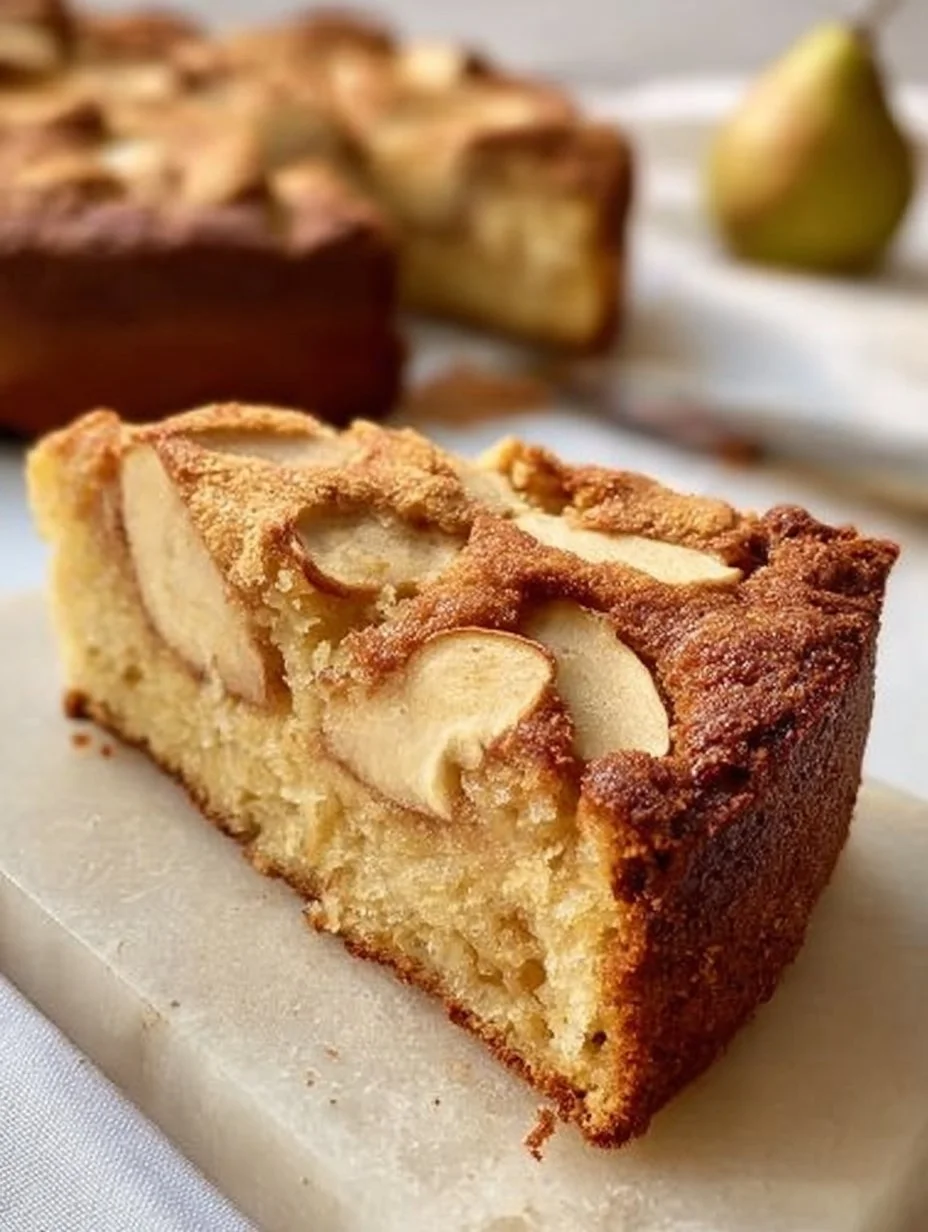 Deliciously moist Almond Flour Apple Cake topped with sliced apples and cinnamon.