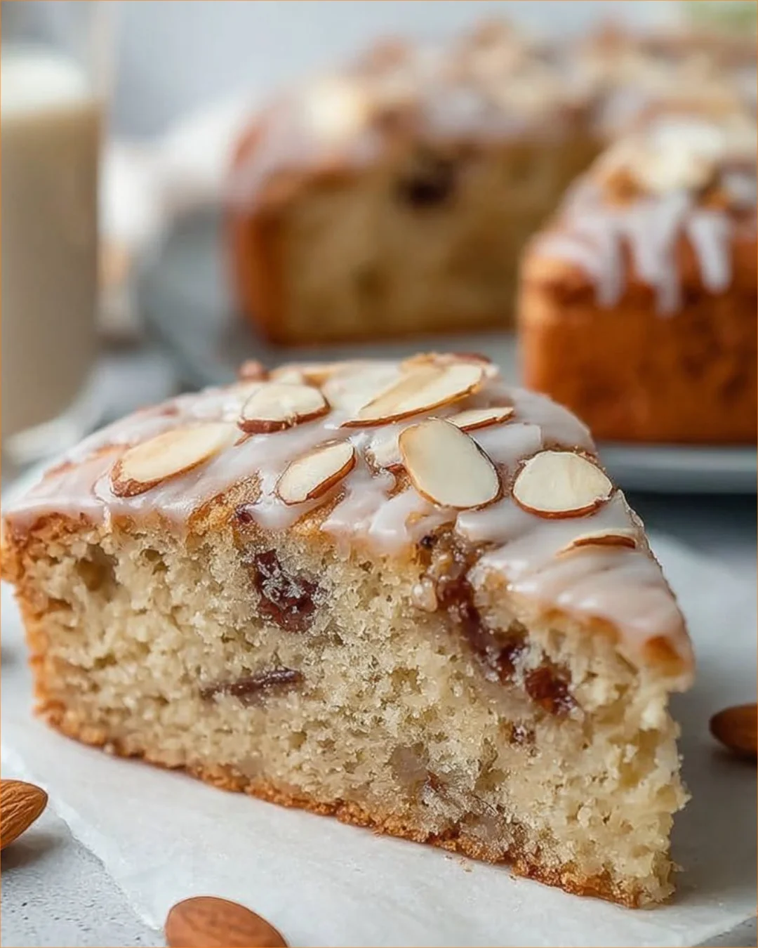 Flourless Almond Joy Greek Yogurt Cake topped with coconut and almonds