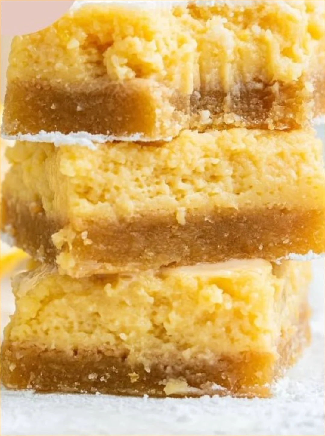 Delicious zesty lemon bliss bars on a plate ready to be served