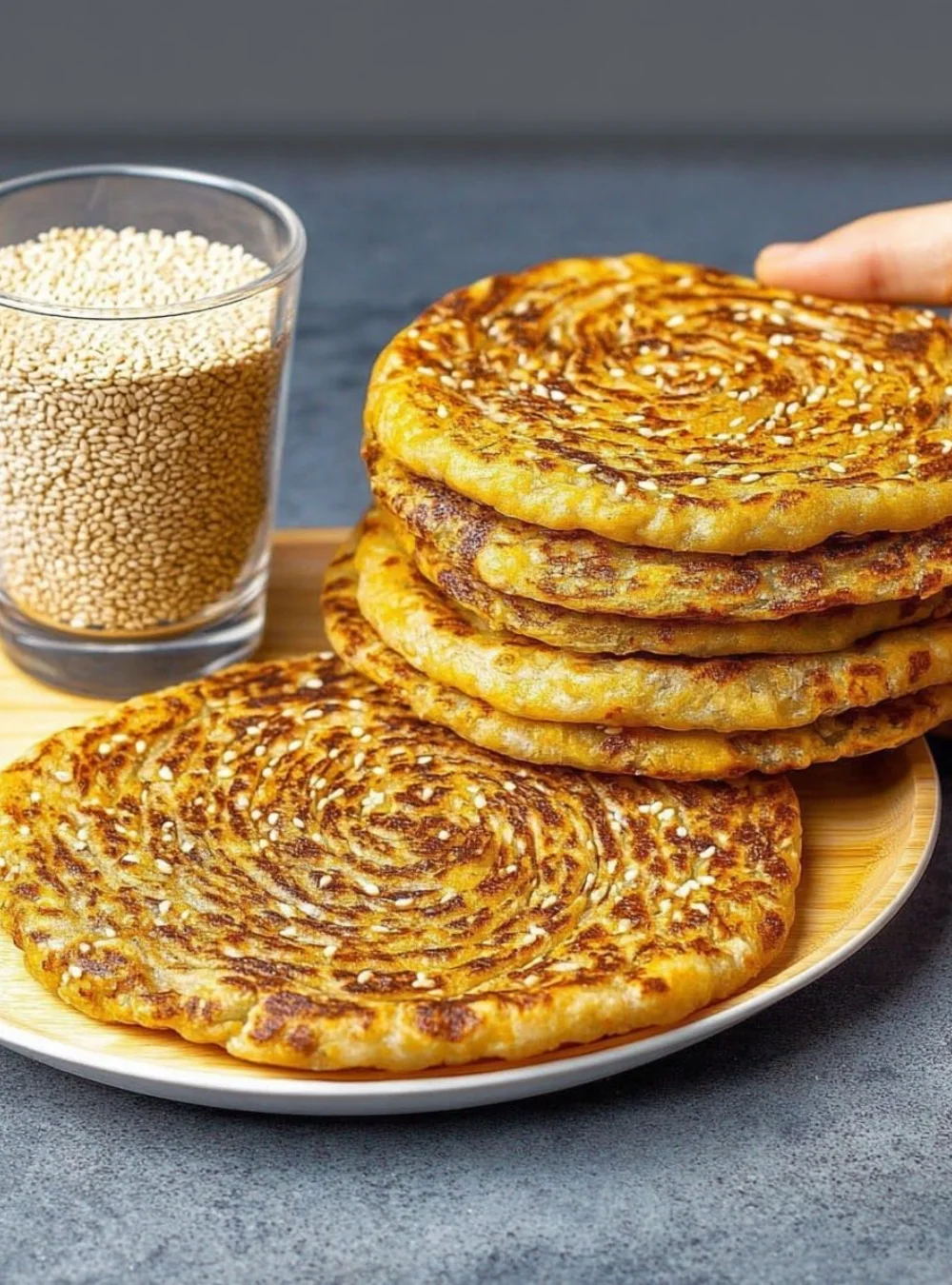 A slice of healthy flourless protein-packed bread on a wooden cutting board.