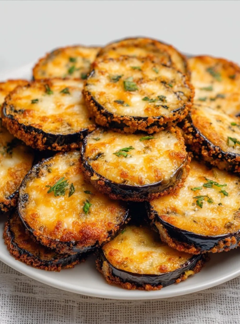 Delicious restaurant-style baked eggplant served with fresh herbs