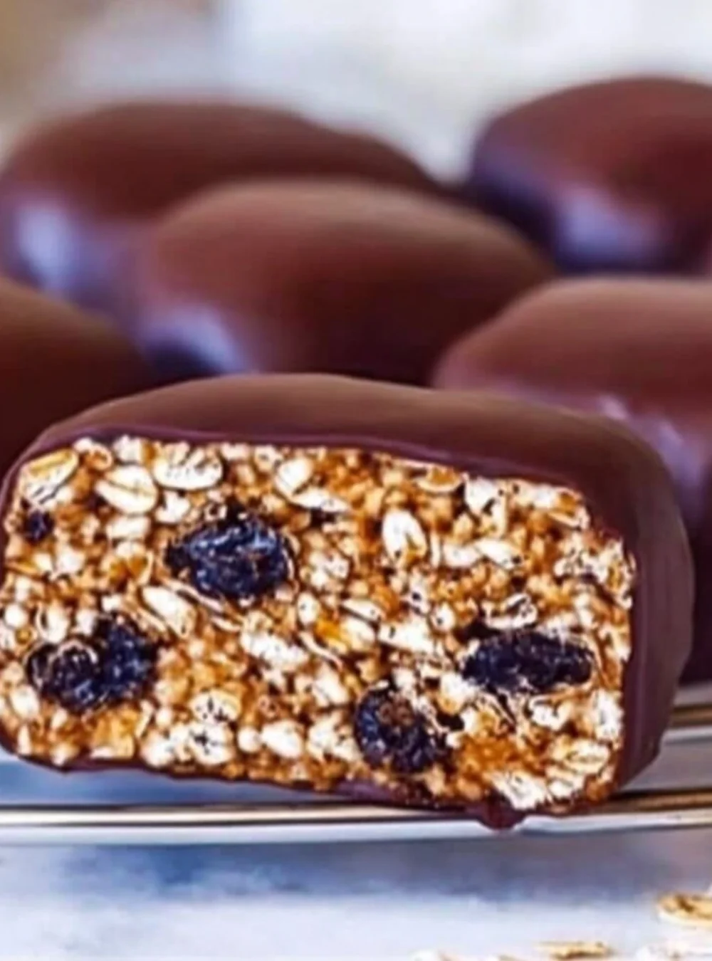 Homemade oatmeal sweets with dried fruit on a wooden table
