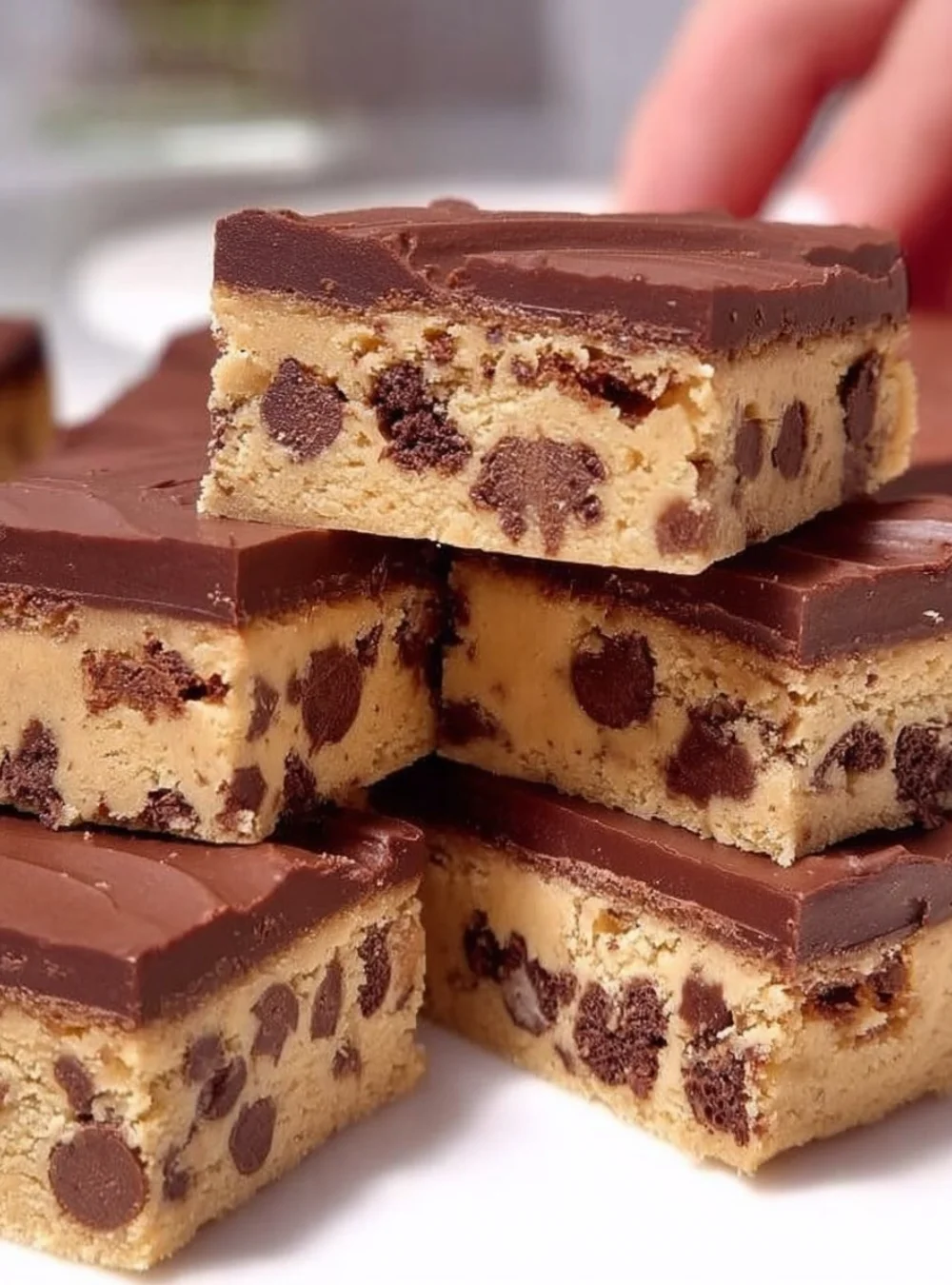 No-bake chocolate biscuit bars topped with chocolate and nuts