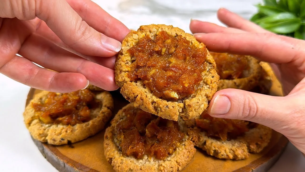 Plate of freshly baked, delicious cookies with a golden-brown color.